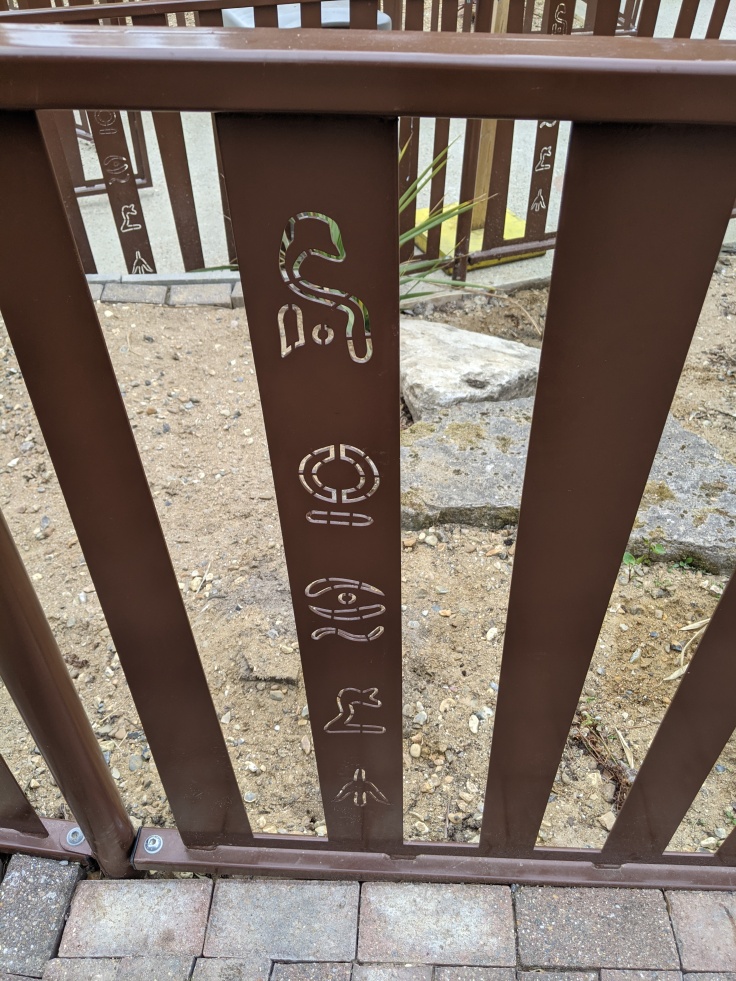 Hieroglyphs in the queue fence for Croc Drop at Chessington